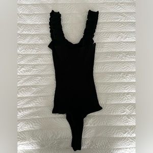 Francesca’s black ribbed bodysuit